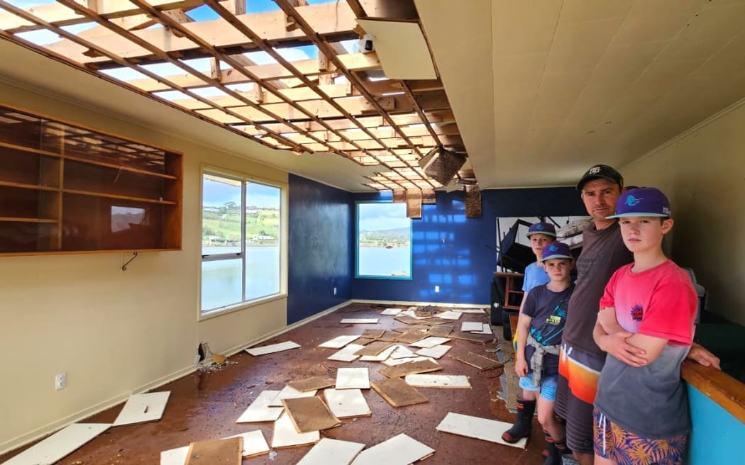 Members survey the damage at Taipā Sailing Club, in the Far North’s Doubtless Bay.