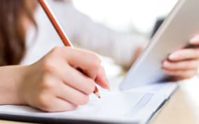 Student, tablet, education. (stock image)