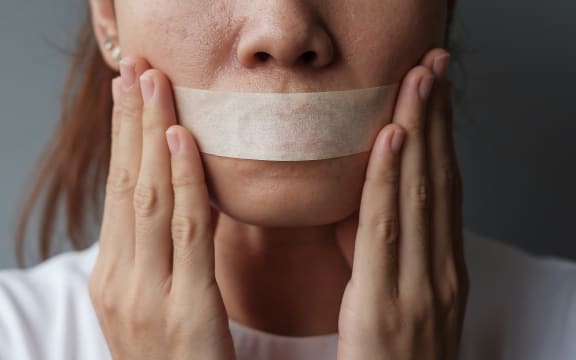 woman with mouth sealed in adhesive tape. Free of speech, freedom of press, Human rights, Protest dictatorship, democracy, liberty, equality and fraternity concepts