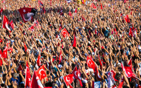Tens of thousands of people take part in a pro-democracy rally in Istanbul, condemning the nation's attempted coup.