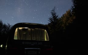 freedom camping. van. night time.