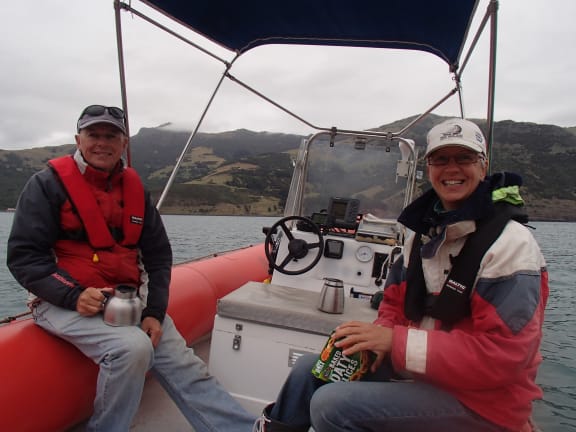 Two people on a small boat