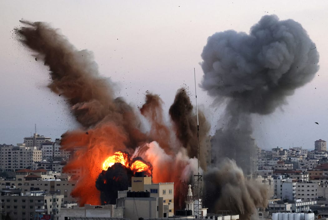 Smoke billows after an Israeli airstrike on Gaza City targeted the Ansar compound, linked to the Hamas movement, in the Gaza Strip on May 14, 2021.