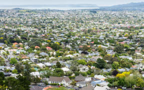 View from above of residential streets and houses   housing in Auckland.