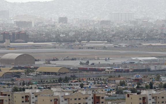 Military helicopters standing on the tarmac at a military airport in Kabul.
