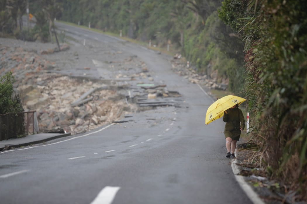 Road washed out just north of Punakaiki rocks. 500m stretch of road and footpath was damaged by king tides during the storm.