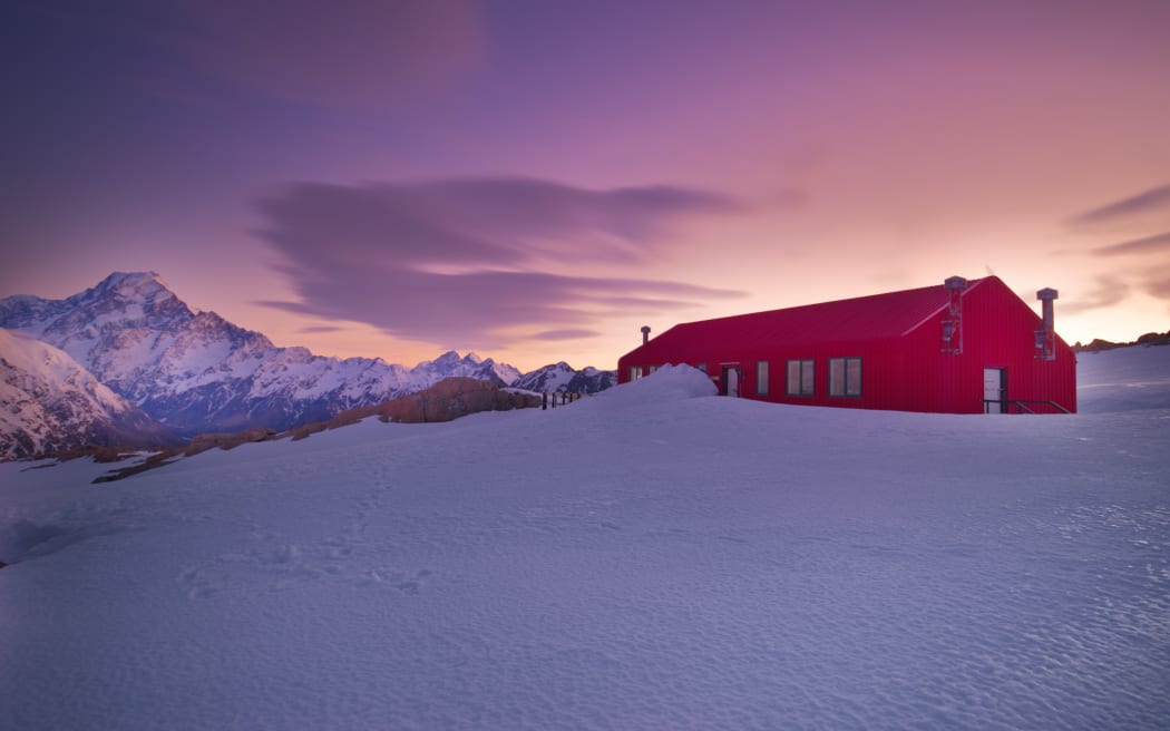 Sunrise over Mueller Hut with Mt Aoraki in the distance,