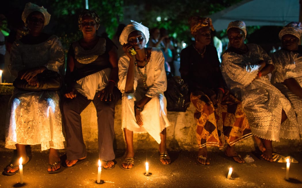 People in Sierra Leone gathered at the iconic Cotton Tree in Freetown, to remember the lives lost to Ebola on November 6. (Photo by Maria de la Guardia/NurPhoto)