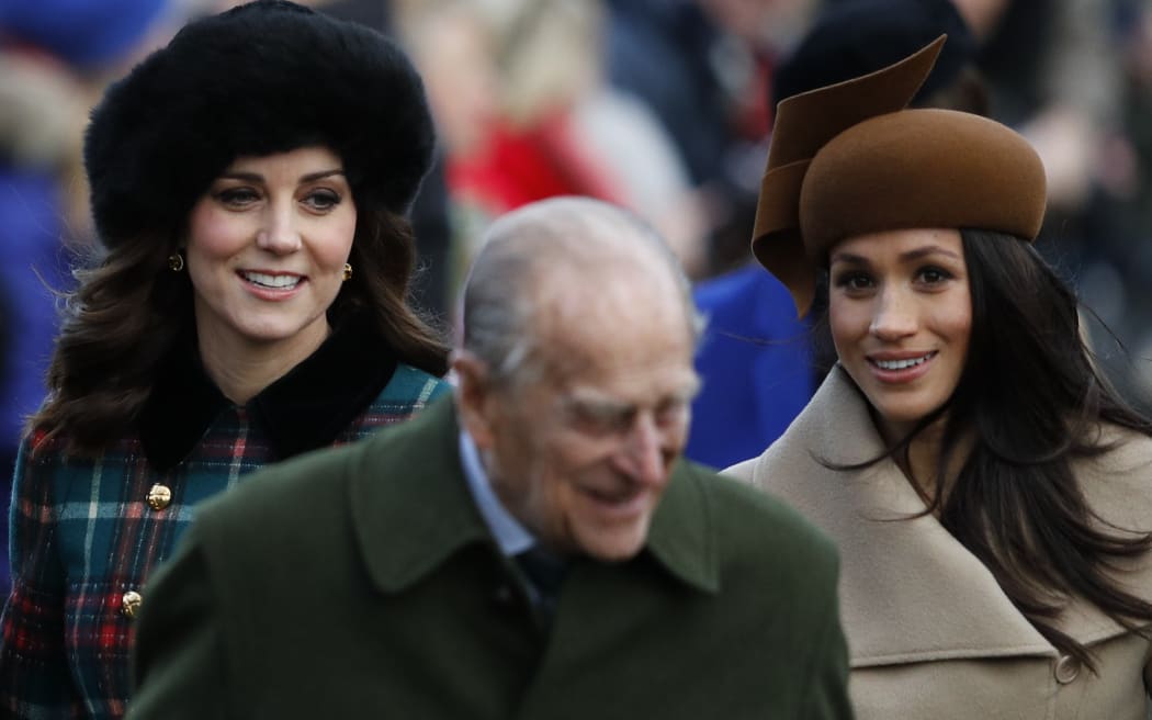 (L-R) Britain's Catherine, Duchess of Cambridge, Britain's Prince Philip, Duke of Edinburgh and US actress and fiancee of Britain's Prince Harry Meghan Markle (R) arrive to attend the Royal Family's traditional Christmas Day church service.
