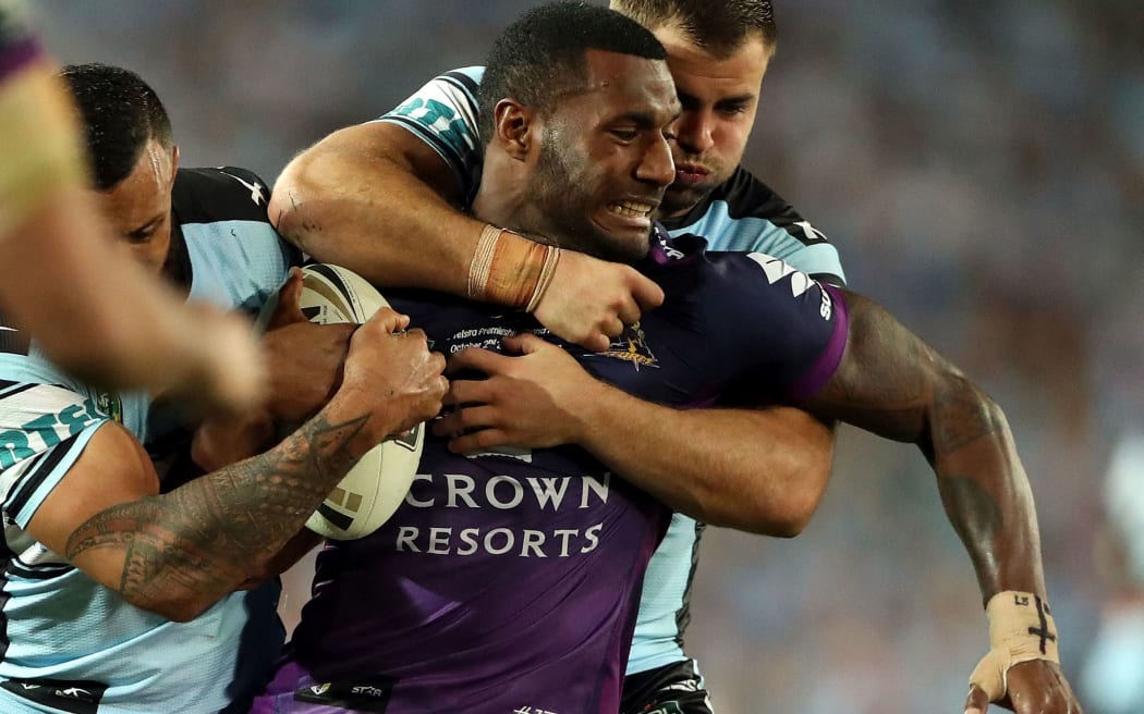 Fij-born winger Suliasi Vunivalu is tackled during the 2016 NRL Grand Final.