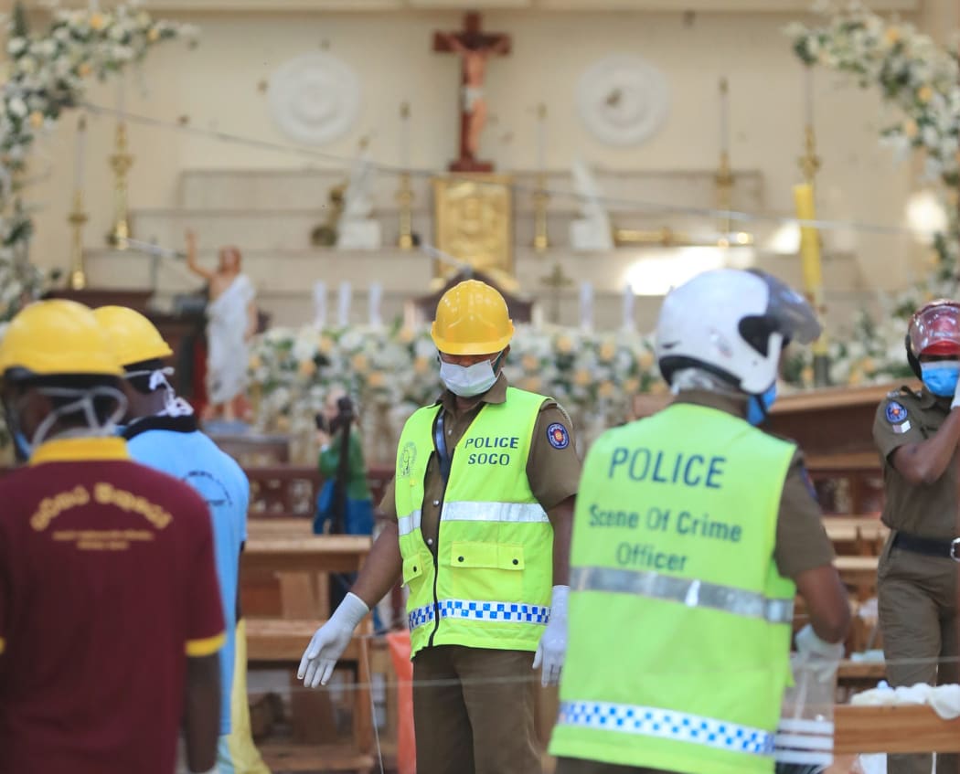 Investigators working in St. Sebastian Church in Negombo, Sri Lanka on April 23, 2019, two days after the church was hit in series of bomb blasts targeting churches and hotels.