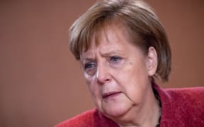 12 December 2018, Berlin: Chancellor Angela Merkel (CDU) is waiting for the start of the cabinet meeting at the Chancellor's Office. Photo: Michael Kappeler/dpa