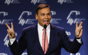 (FILES) In this file photo taken on November 19, 2022, US Representative-elect George Santos speaks at the Republican Jewish Coalition Annual Leadership Meeting in Las Vegas, Nevada. - Santos, a Republican elected to Congress in November, was facing a growing clamor for his resignation on December 27 , 2022, after admitting that he made up large parts of his biography -- but refusing to give up his seat. Santos's victory in a New York district helped his party secure a narrow majority in the House of Representatives -- Congress's lower chamber. (Photo by Wade Vandervort / AFP)