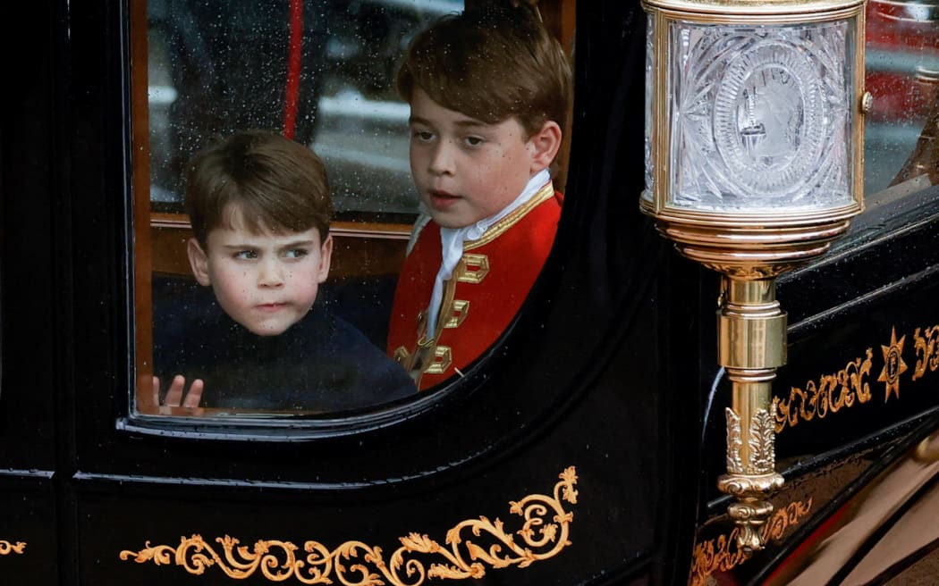 Britain's Prince Louis of Wales (L) and his brother Britain's Prince George of Wales depart following the Coronation Ceremony for Britain's King Charles III and Queen Camilla in Westminster Abbey in central London, on May 6, 2023. - The set-piece coronation is the first in Britain in 70 years, and only the second in history to be televised. Charles will be the 40th reigning monarch to be crowned at the central London church since King William I in 1066. Outside the UK, he is also king of 14 other Commonwealth countries, including Australia, Canada and New Zealand. (Photo by PIROSCHKA VAN DE WOUW / POOL / AFP)