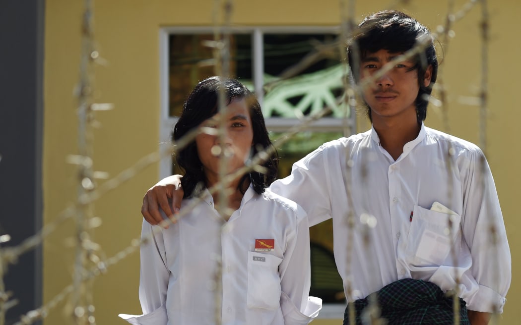Detained Myanmar physics student Myo Htet Paing, 20, and tenth-grade student Lwin Ko Ko Aung, 20, outside the court house in Tharrawady town before their trial. The pair are among 40 students facing charges over education reform protests last March. They face up to ten years in jail if convicted.