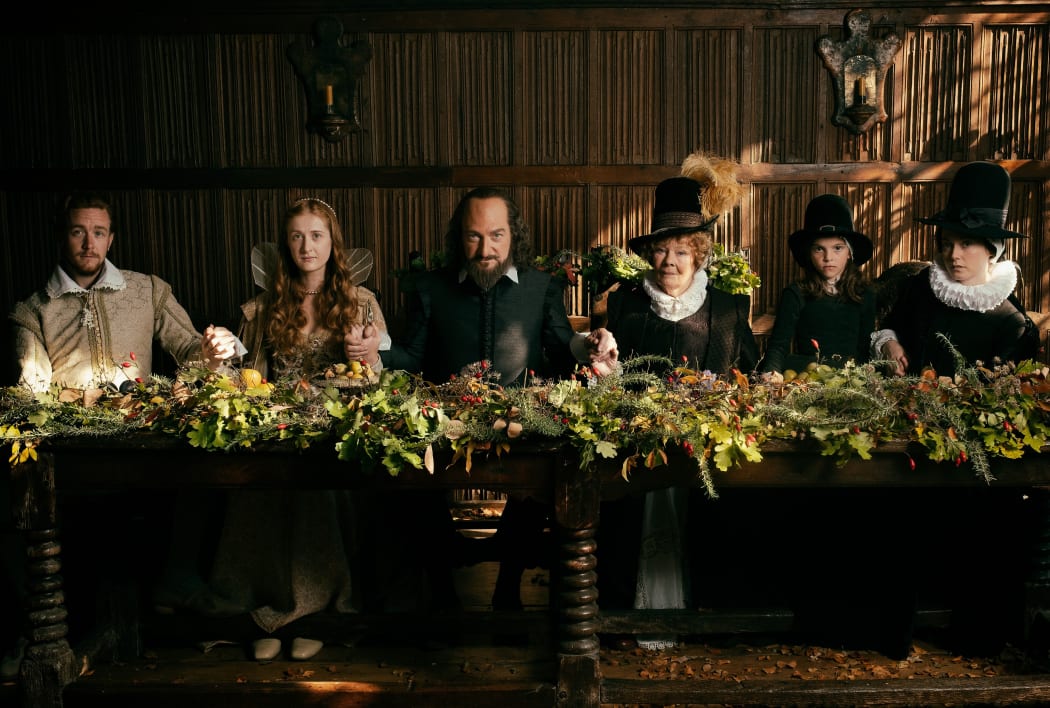 The wedding party celebrates the marriage of Shakespeare’s daughter Judith (Kathryn Wilder, second from left) to wine merchant Tom Quiney (Jack Colgrave Hirst, left).