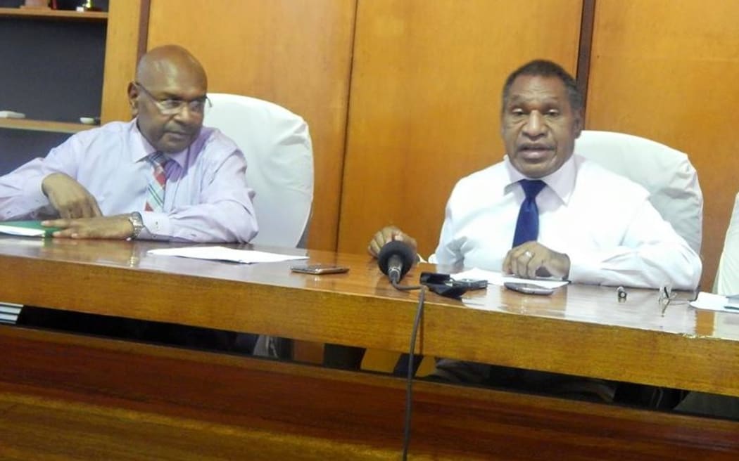 University of PNG acting chancellor Dr Nicholas Mann, right, with vice-chancellor Professor Albert Mellam