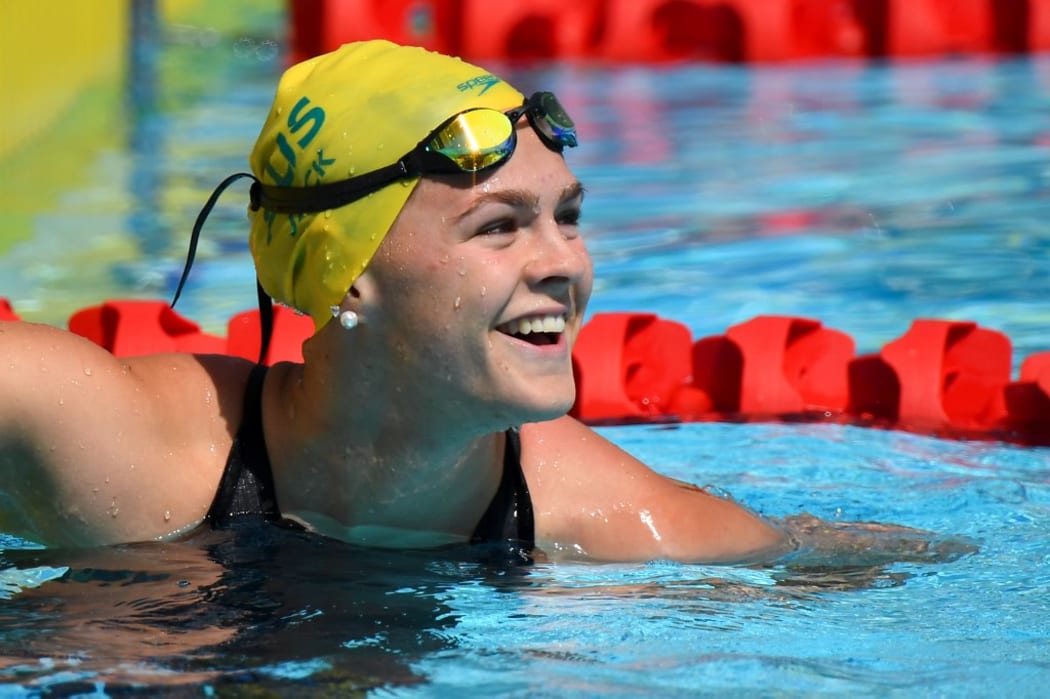 (FILES) In this file photo taken on April 6, 2018 Australia's Shayna Jack smiling after the swimming women's 50m freestyle qualifications during the 2018 Gold Coast Commonwealth Games  in the Gold Coast.