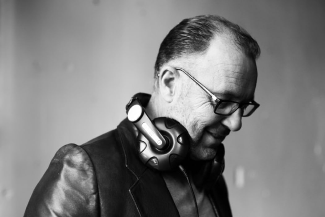 Peter Urlich wearing headphones around his neck
