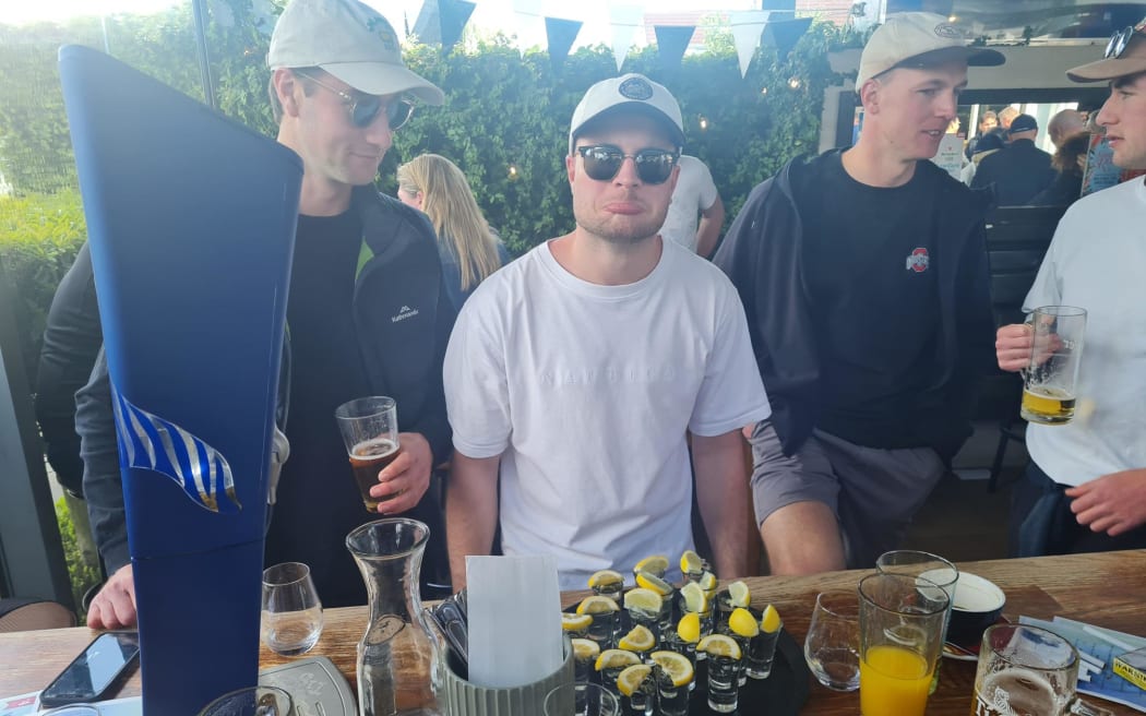 All Blacks fans at Christchurch's No. 4 bar and restaurant react after the final whistle in the 2023 Rugby World Cup match between New Zealand and South Africa.