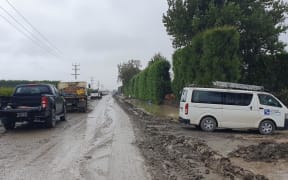 Rain turns silt to mud, adding to traveling time, and risks, in Pakowhai.