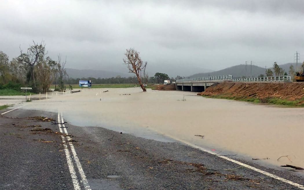 Flood waters submerging part of a highway near the Cyclone Debbie-hit Bowen area in Queensland.