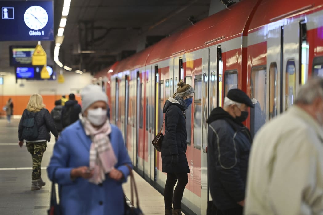 People wear masks on public transport in Munich, Germany.