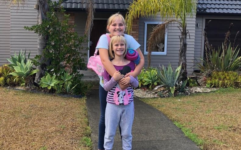 Olivia and Maddi Newson going on a bear hunt in Orewa, Auckland.