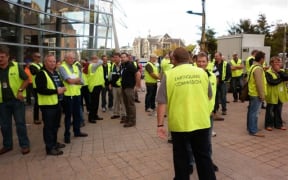 Earthquake Commission staff gather outside the Civil Defence headquarters on Thursday.