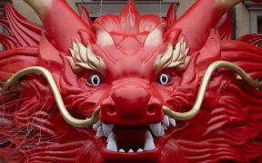 A sculpture installation is being decorated with the theme of the Chinese Year of the Dragon in Shanghai, China, on January 31, 2024. (Photo by Costfoto/NurPhoto) (Photo by CFOTO / NurPhoto / NurPhoto via AFP)
