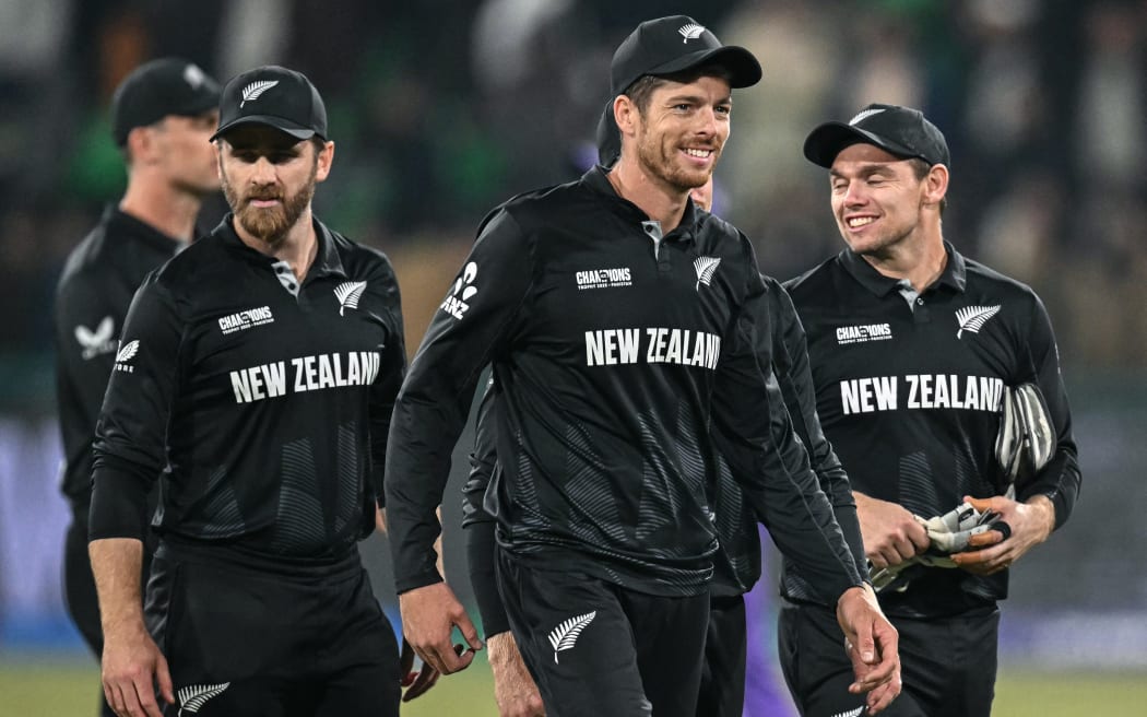 New Zealand's captain Mitchell Santner (C) and his teammates gesture after winning the ICC Champions Trophy one-day international (ODI) semi-final cricket match between New Zealand and South Africa at the Gaddafi Stadium in Lahore on March 5, 2025. New Zealand qualified for the Champions Trophy final with a clinical 50-run win against South Africa in the second semi-final in Lahore on March 5. (Photo by Aamir QURESHI / AFP)