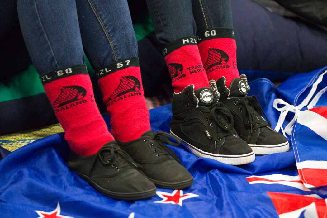 Red socks and fans at Shed 10, watch the America's Cup racing between Team New Zealand and Oracle in San Francisco, USA, Tuesday, September 24, 2013.