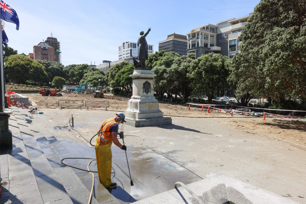 Parliament's forecourt is water blasted just a day after he police cleared the occupation.