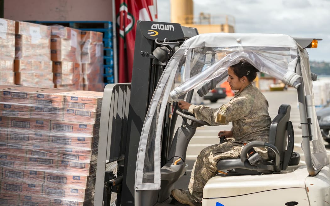 Goods being loaded onto the HMNZS Canterbury before it left for Port Vila.