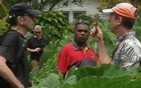 Dr Vincent Lebot in his Port Vila taro garden with visiting scientists.