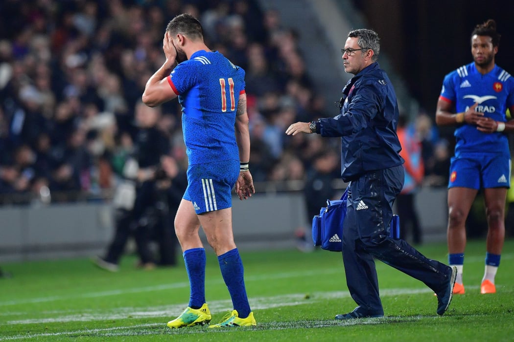France's Remy Grosso (L) walks from the field after running into All Blacks Ofa Tu'ungafasi and Sam Cane during the Steinlager Series rugby match between the All Blacks and France at the Eden Park in Auckland on Saturday the 9th of June 2018. Copyright Photo by Marty Melville / www.Photosport.nz