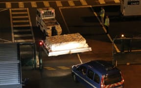 The debris was packed into a crate for the flight to Paris.