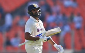 India's captain Rohit Sharma walks back to the pavilion after his dismissal during the third day of the fourth and final Test cricket match between India and Australia at the Narendra Modi Stadium in Ahmedabad on March 11, 2023. (Photo by Punit PARANJPE / AFP) / ----IMAGE RESTRICTED TO EDITORIAL USE - STRICTLY NO COMMERCIAL USE-----