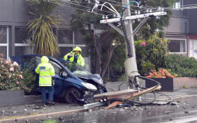 Police at the scene of a serious crash in Macandrew road which left hundreds without power

PHOTO STEPHEN JAQUIERY