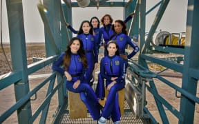From left - entrepreneur Lauren Sanchez, former NASA scientist Amanda Nguyen, singer Katy Perry, TV presenter Gayle King, former NASA scientist Aisha Bowe and film producer Kerianne Flynn pose in their spacesuits ahead of an all-woman sub-orbital mission aboard the New Shepard rocket.