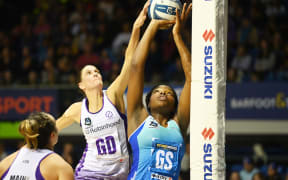 Anna Harrison (L) defends over Grace Nweke.