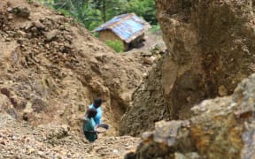 Gold panning on the fringe of Bougainville's Panguna mine, decades after it was closed for large scale mining.