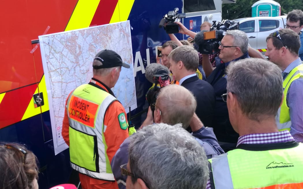 Prime Minister Bill English, centre, and Civil Defence Minister Gerry Brownlee at emergency services headquarters.