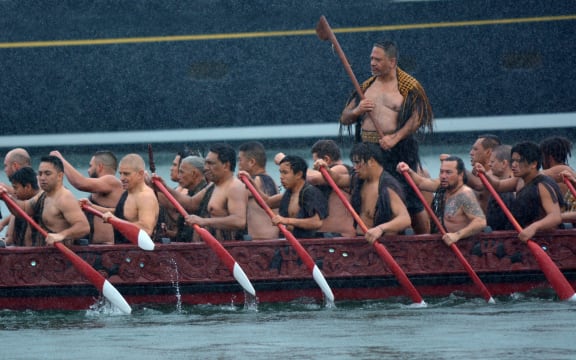 Māori waka sailing in Auckland, New Zealand.