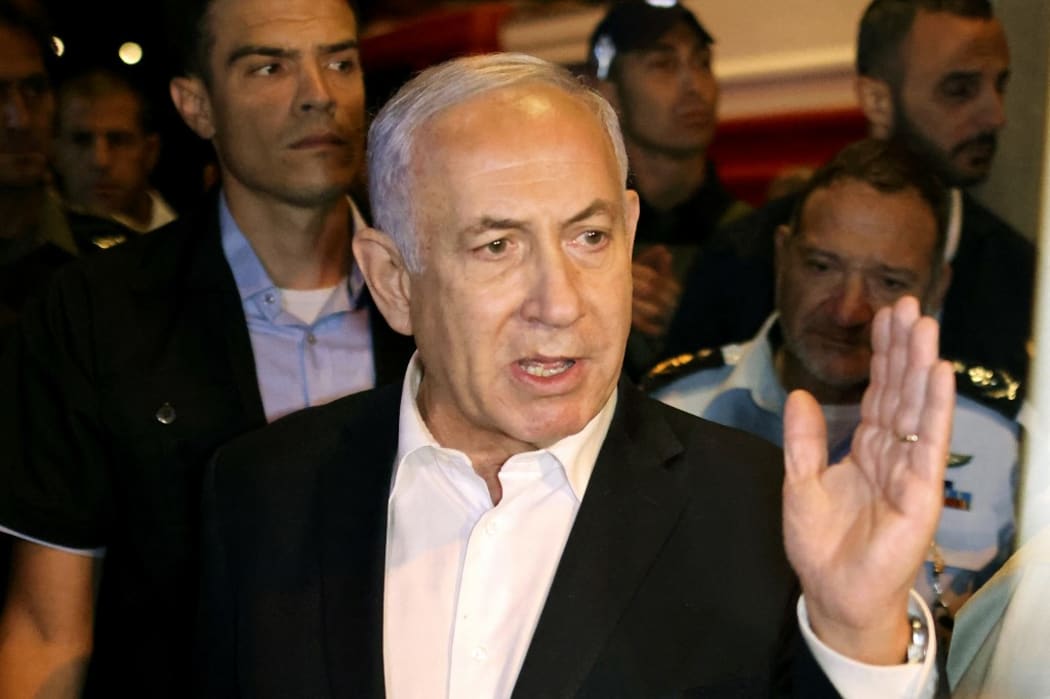 Israeli Prime Minister Benjamin Netanyahu tours the city of Lod early on May 12, 2021.