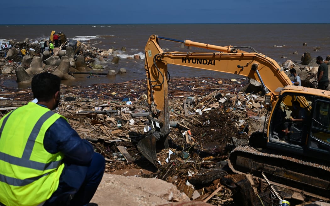 Emirati Rescue Team members working through the debris in Derna, on 16 September.