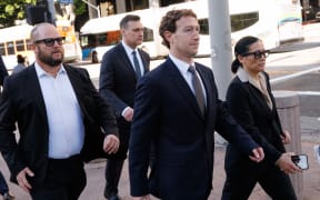 Meta CEO and Chairman Mark Zuckerberg arrives at Los Angeles Superior Court ahead of the social media trial tasked to determine whether social media giants deliberately designed their platforms to be addictive to children, in Los Angeles, on February 18, 2026. Zuckerberg is scheduled to testify Wednesday. (Photo by Patrick T. Fallon / AFP)