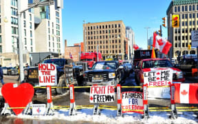 OTTAWA, CANADA - FEBRUARY 07: Protesters of the Freedom convoy gather near the parliament hill as truckers continue to protest in Ottawa, Canada on February 7, 2022.