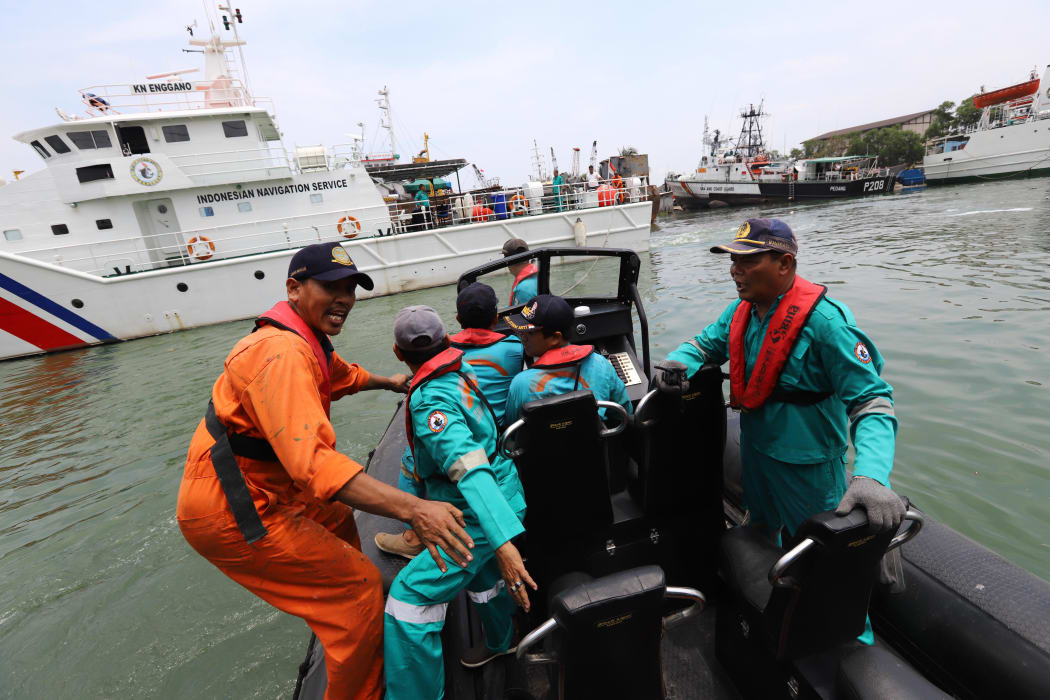 Members of a rescue team prepare to search for survivors from the Lion Air flight JT 610, which crashed into the sea.