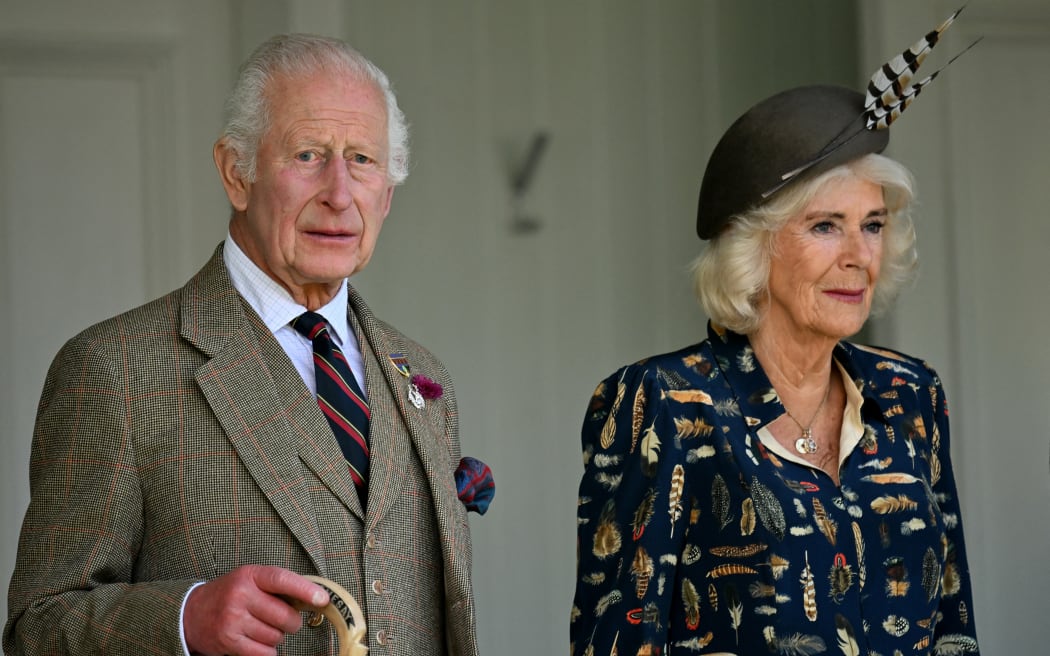 Britain's King Charles III and Britain's Queen Camilla attend the annual Braemar Gathering in Braemar, central Scotland, on September 7, 2024. - The Braemar Gathering is a traditional Scottish Highland Games which predates the 1745 Uprising, and since 1848 it has been regularly attended by the reigning Monarch and members of the Royal Family. (Photo by ANDY BUCHANAN / AFP)
